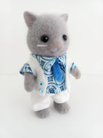 sylvanian families fathers blue and white abstract pattern shirt.Plain white trousers.White vest with two blue diamonds on the front of vest.